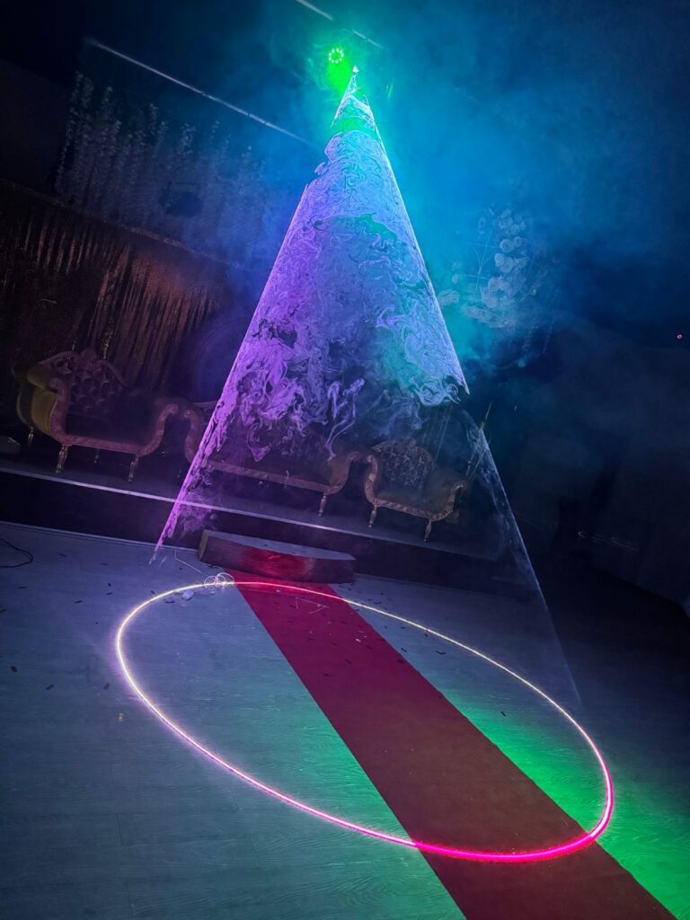 Stage with decorative smoke and light effects at Baab-e-Salaam wedding venue