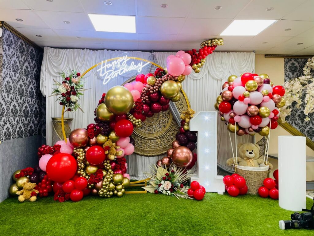 Birthday party setup at Baab-e-Salaam with balloon decor, floral accents, and teddy bears
